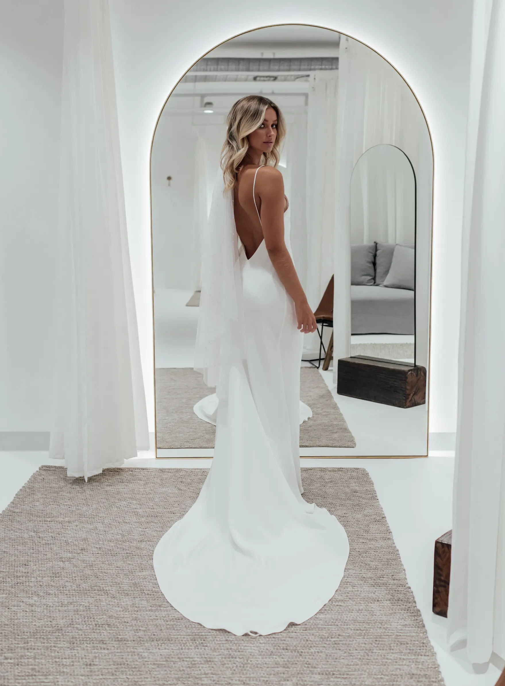 Bride wearing the Grace Loves lace Summer Silk wedding dress with arch illuminated mirror