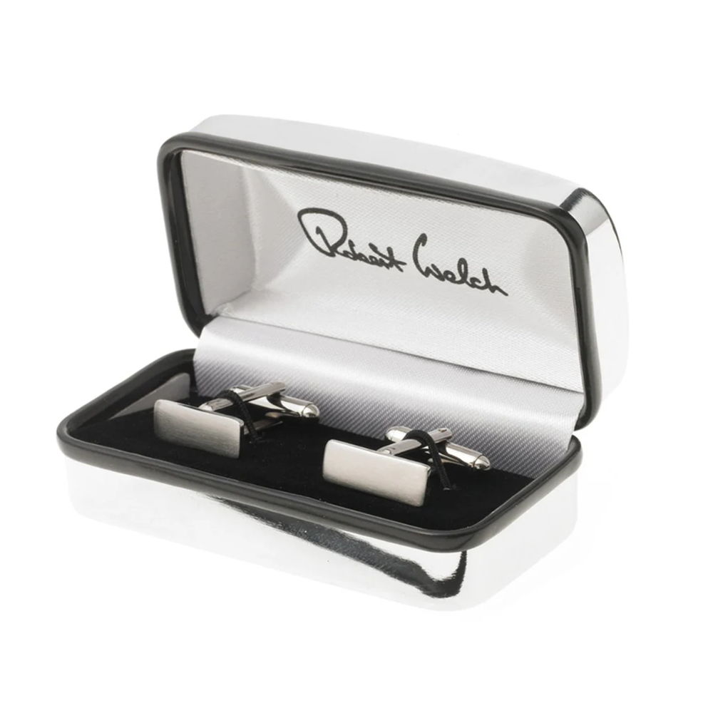 Sterling silver cufflinks in a Robert Welch box, partially open.