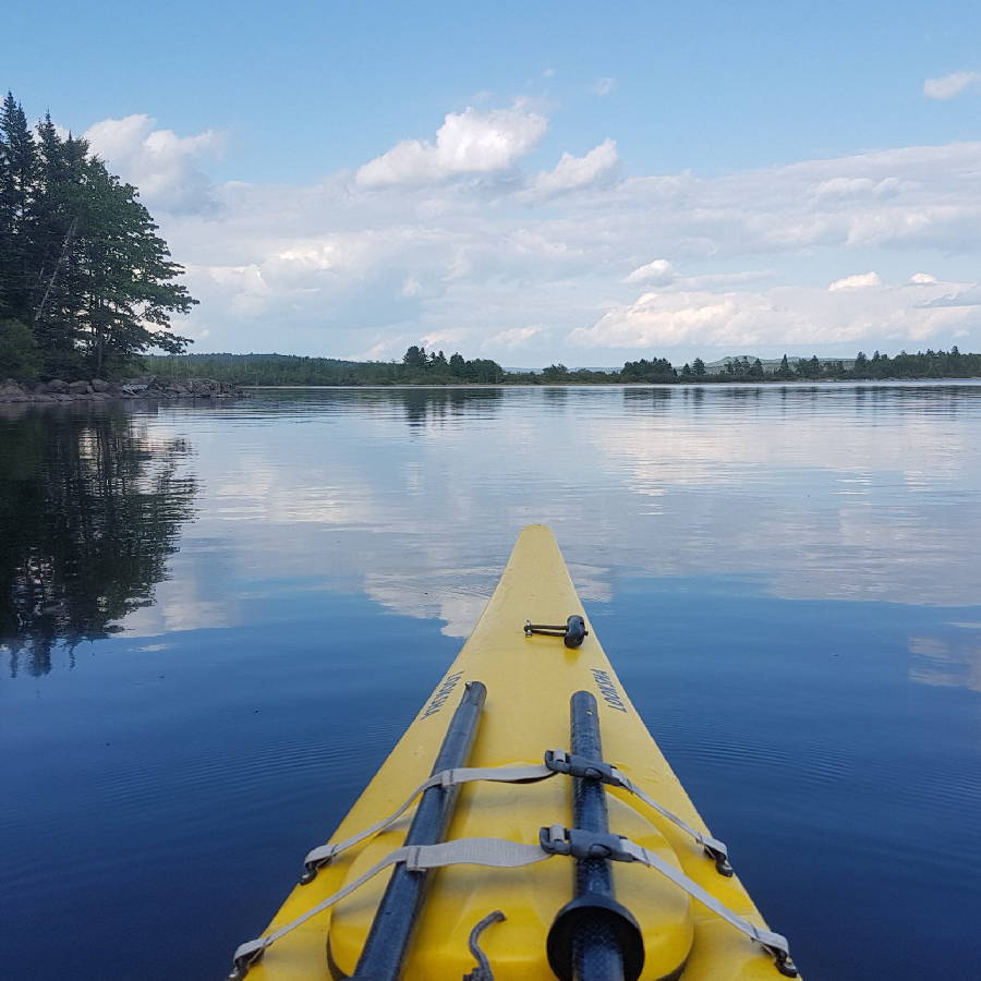 a yellow kayak on a lake