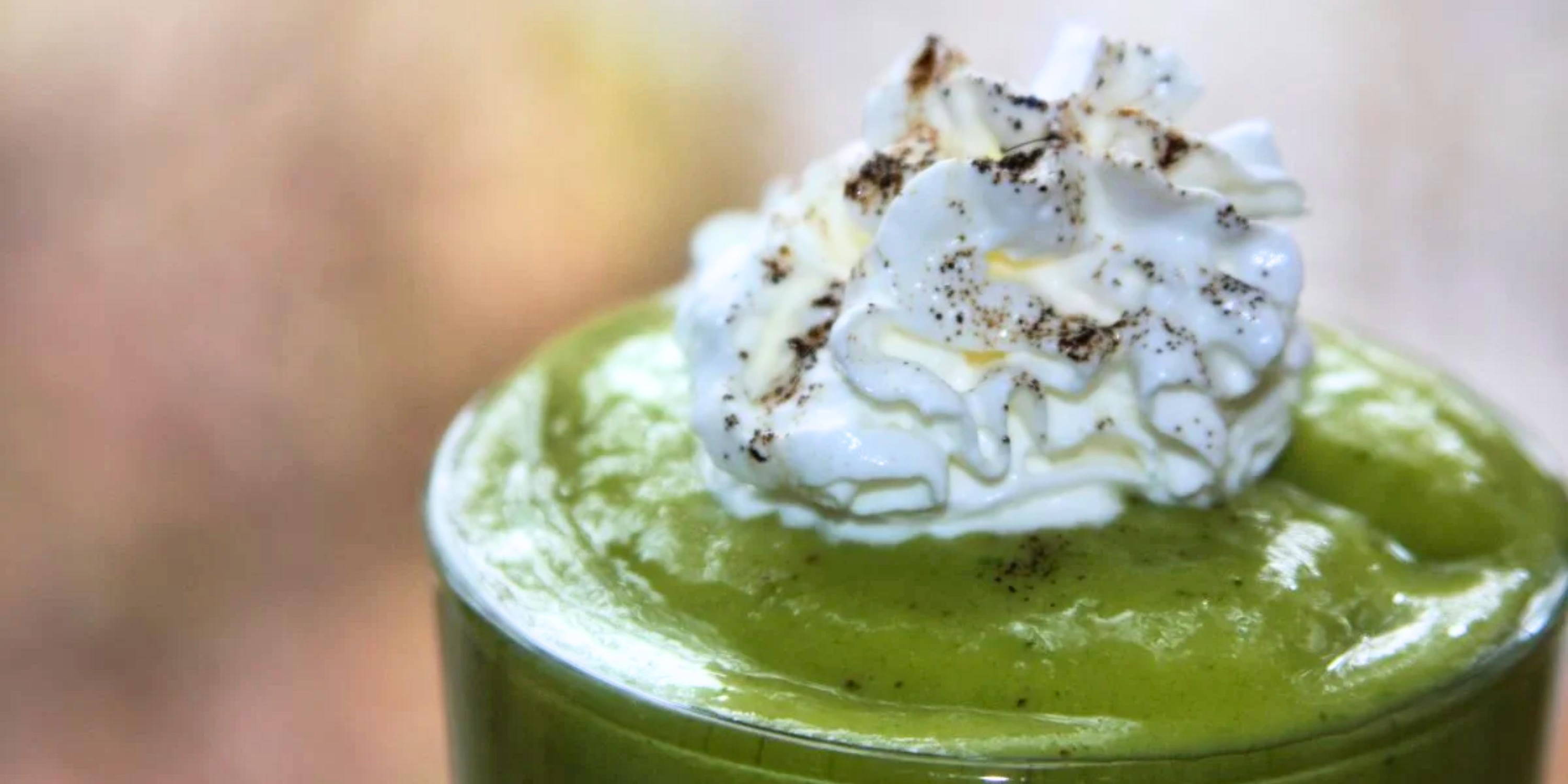 A chaga green smoothie with whipped topping