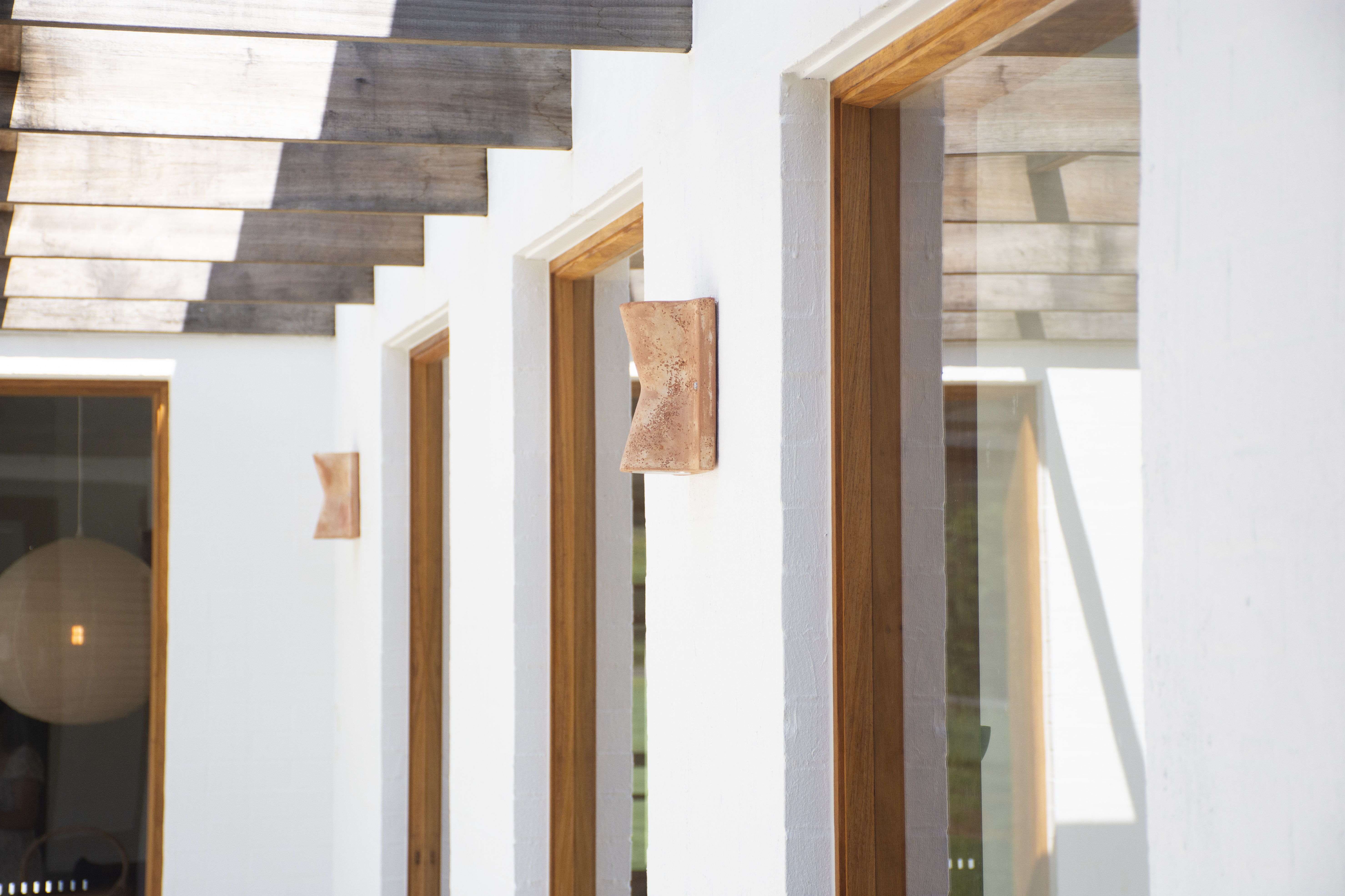 Italian Up Down Outdoor Wall Light on exterior white wall