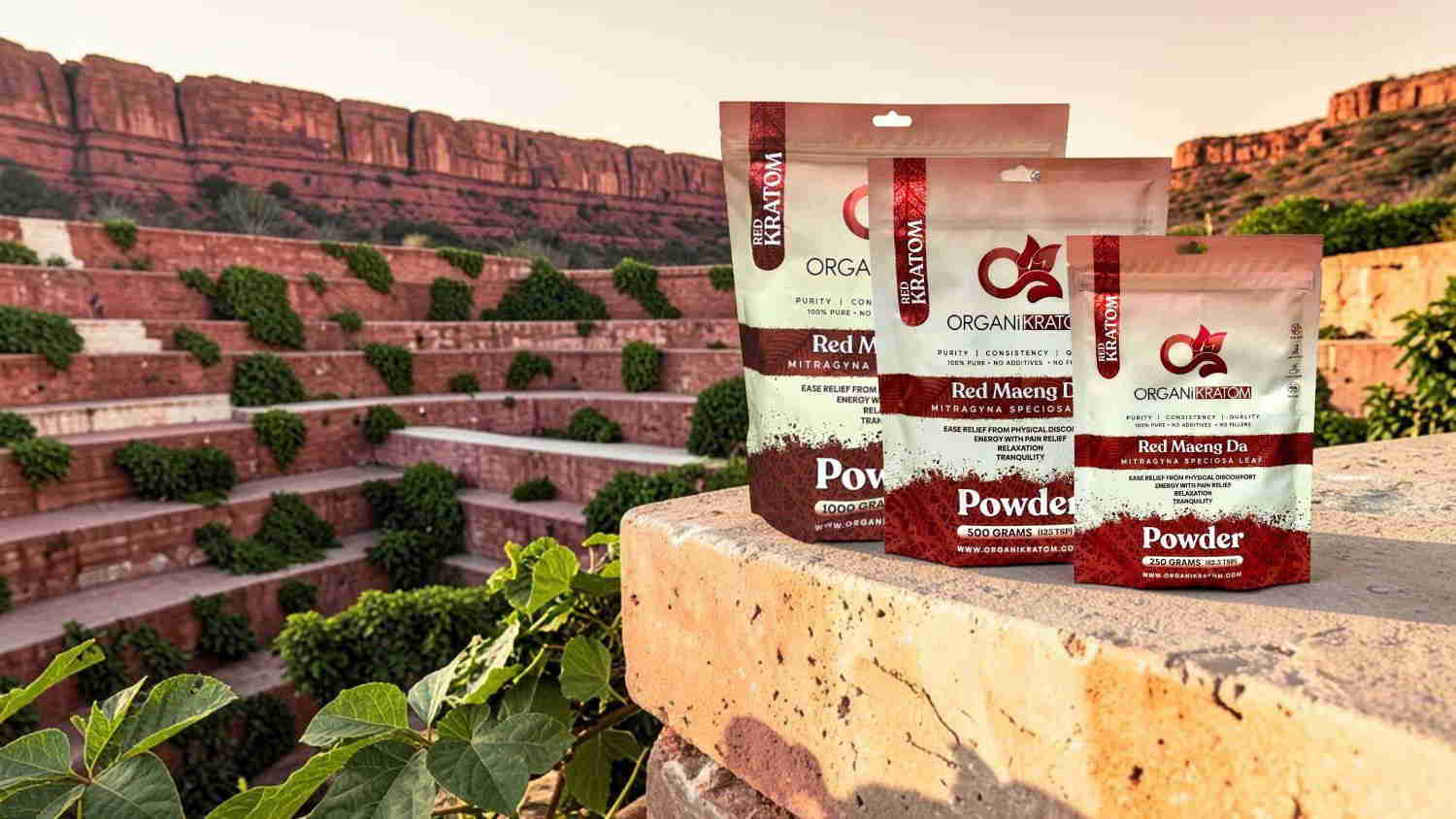 Packs of powdered products displayed on a stone ledge in a scenic landscape.