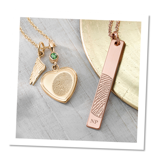 yellow gold charm and rose gold vertical bar pendant