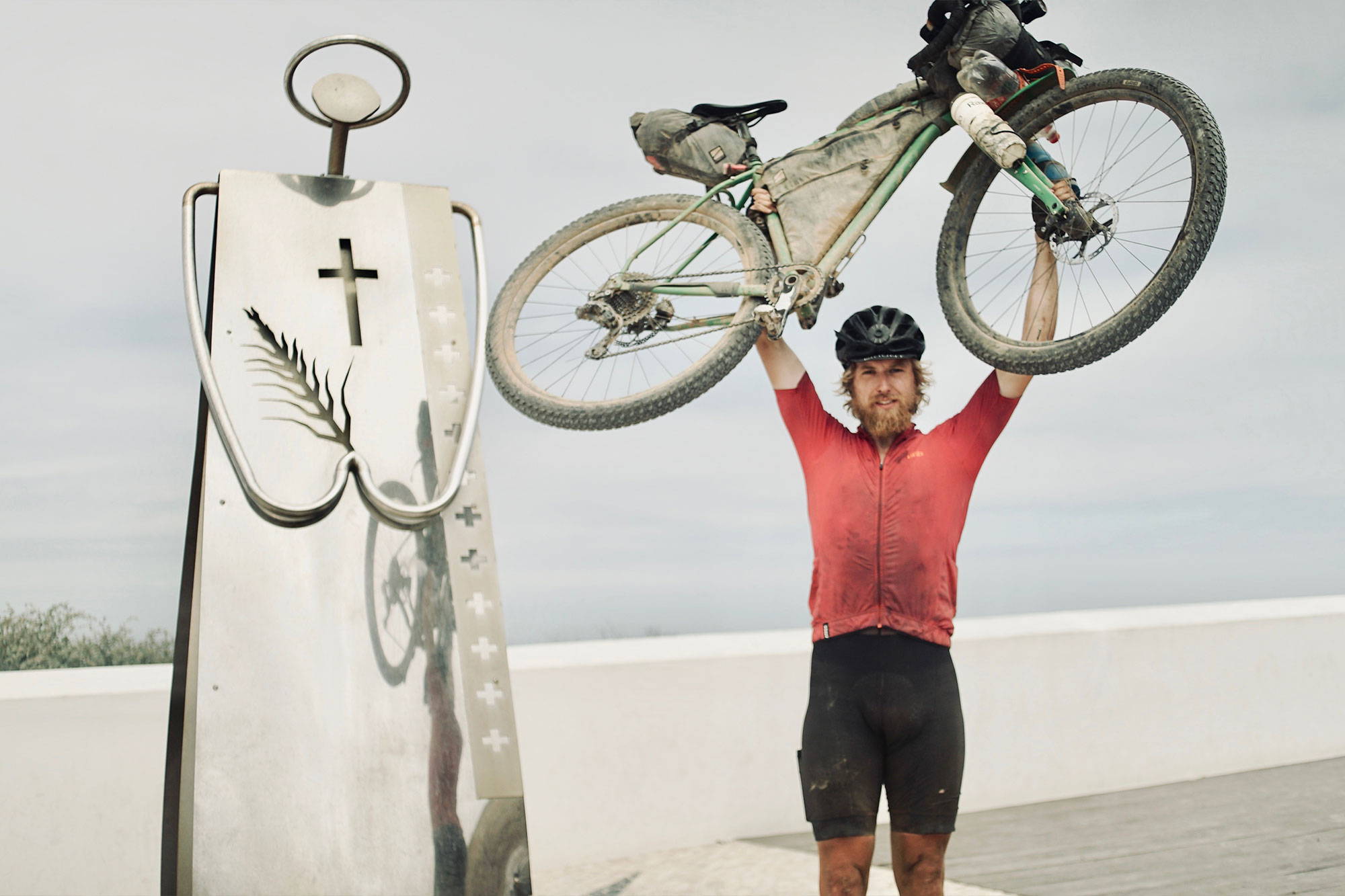 Angus holding his bike aloft