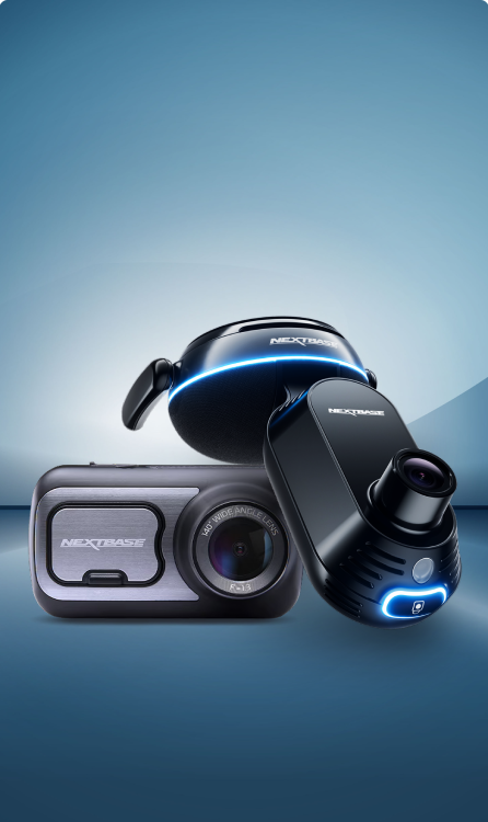 Three modern cameras with sleek designs on a blue background.