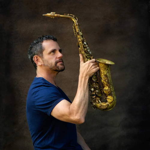 Andy Snitzer holding. amark VI alto saxophone