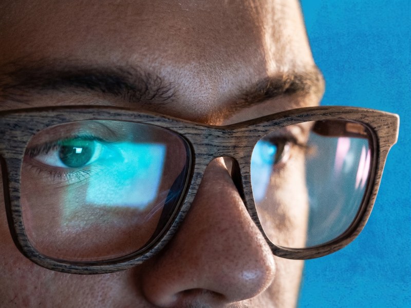 guy wearing Bold Brown blue liight glasses while on screen