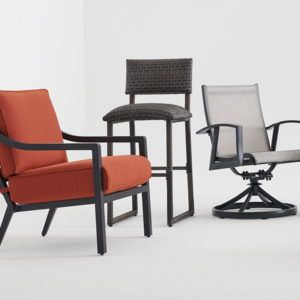Three different styles of chairs against a plain background.