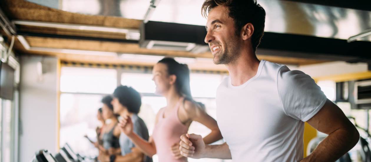person working out to help regrow their hair and promote scalp circulation