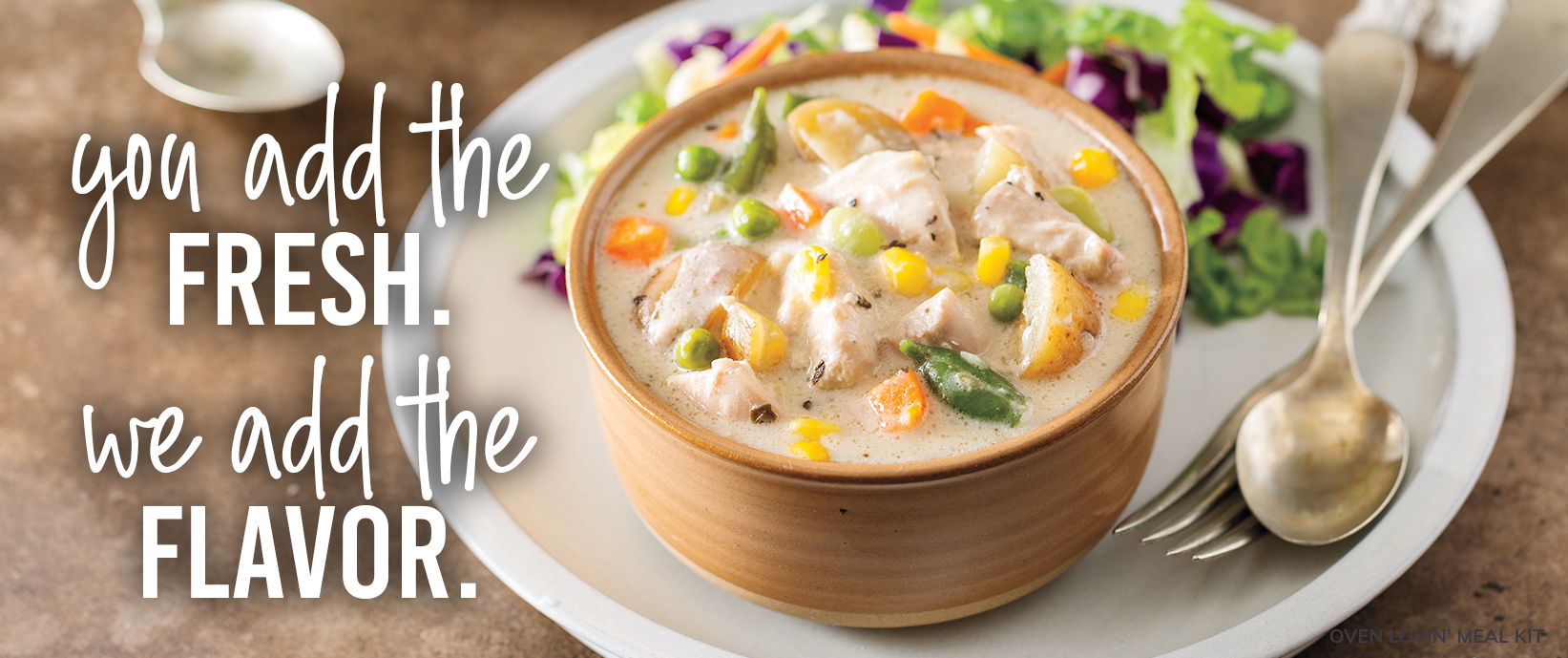 You add the fresh. We add the flavor. Bowl of creamy chicken and vegetable soup served with a side salad.
