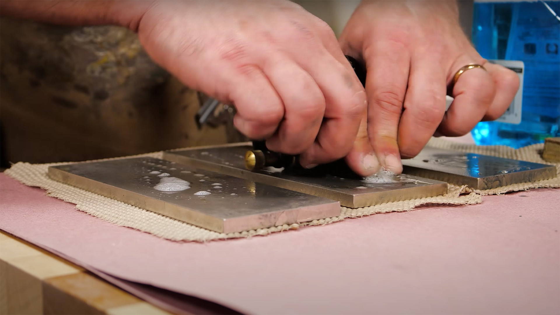 sharpening a chisel on a diamond stone