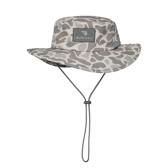 Gray camo bucket hat with a chin strap and logo patch.