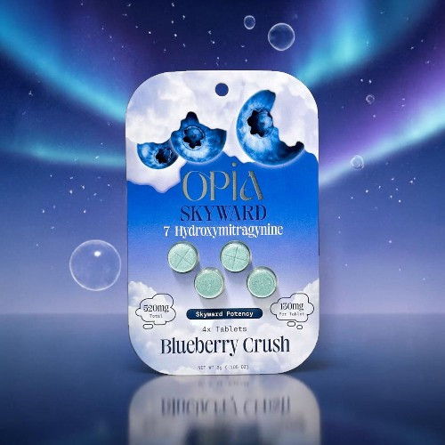 Pack of blueberry-flavored tablets with a vibrant blue background.