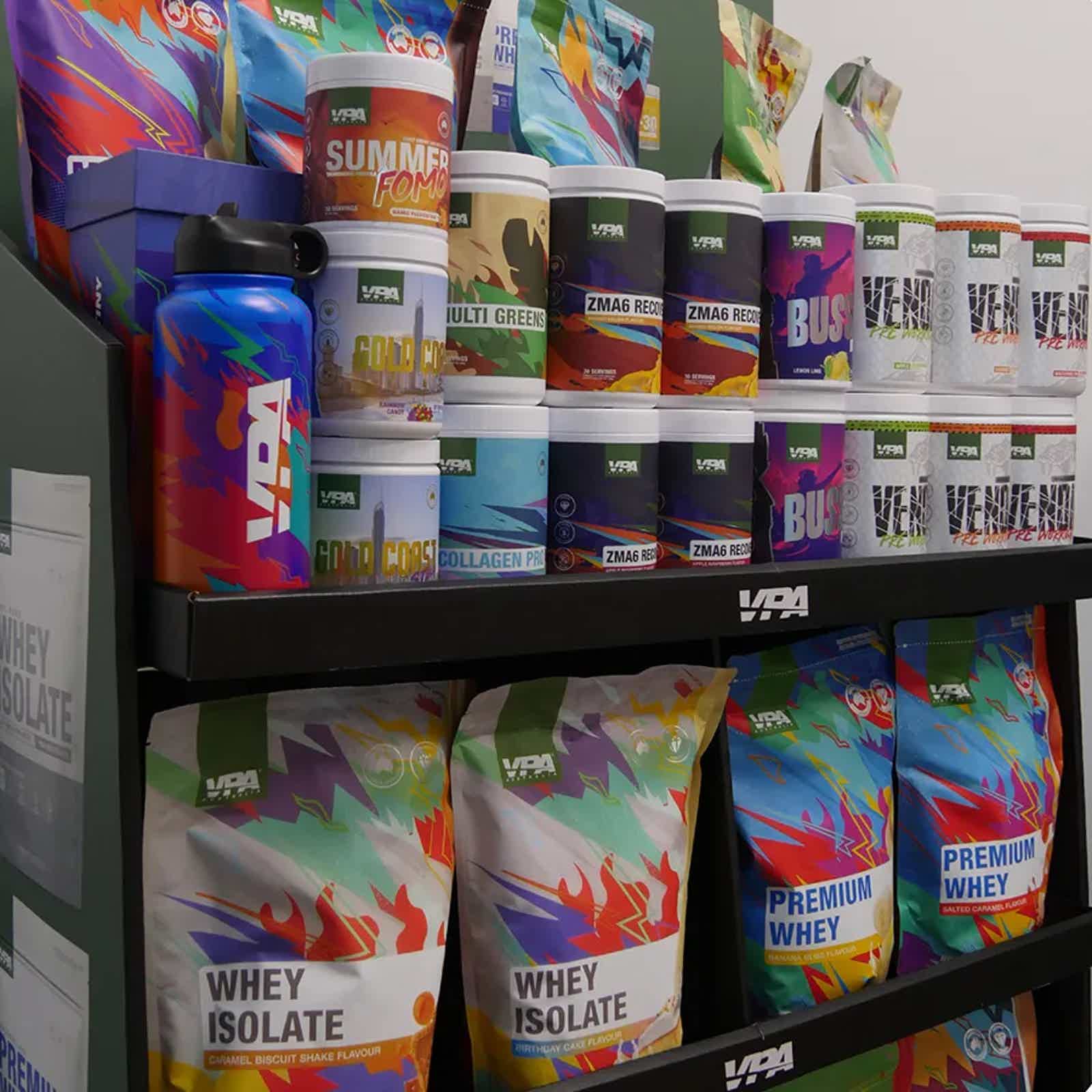 Shelves filled with various protein powder containers and supplements.