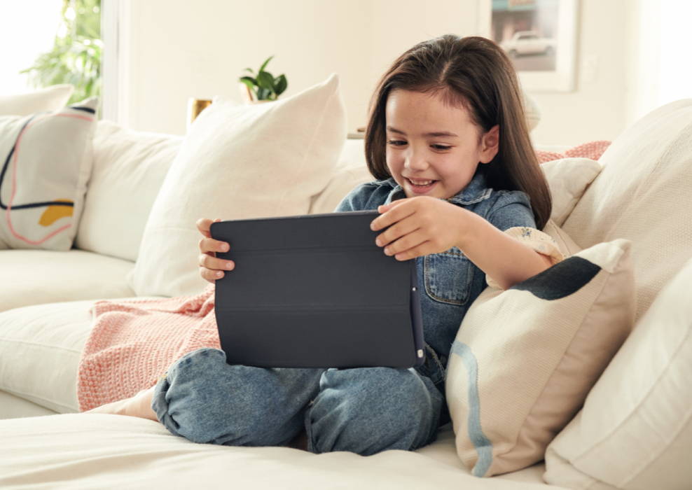 little girl streaming video on an iPad