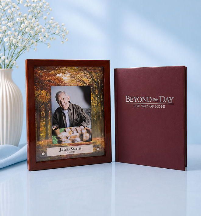 A photo frame with a picture and a book titled 