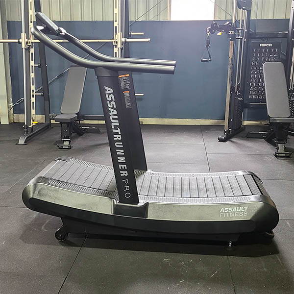 High School Gym Fit Out equipped with a manual curved treadmill, offering a unique and challenging cardiovascular workout experience.