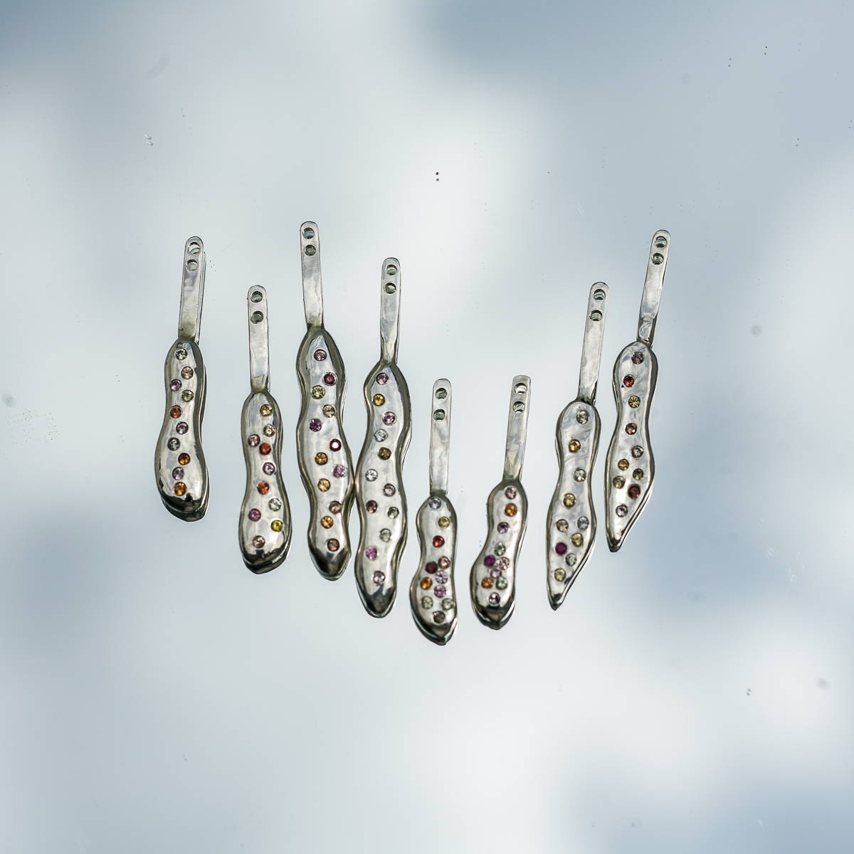 starburst earrings in silver with multicolor sapphires