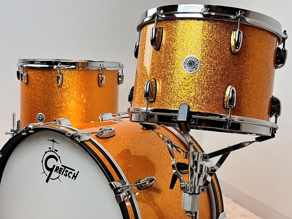 Orange glitter drum set with chrome hardware.