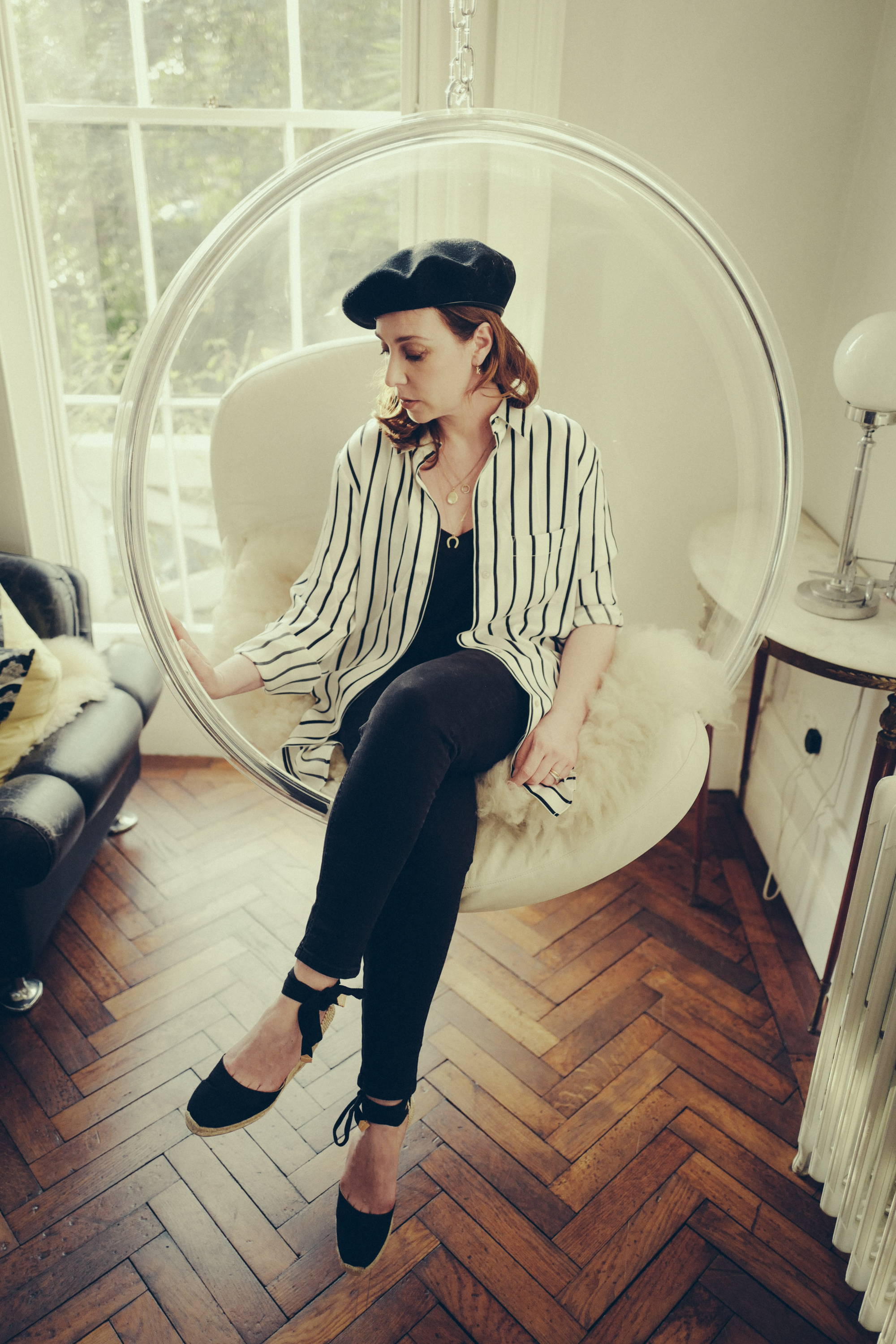 Dee wearing black and white stripe oversized silk pyjama shirt
