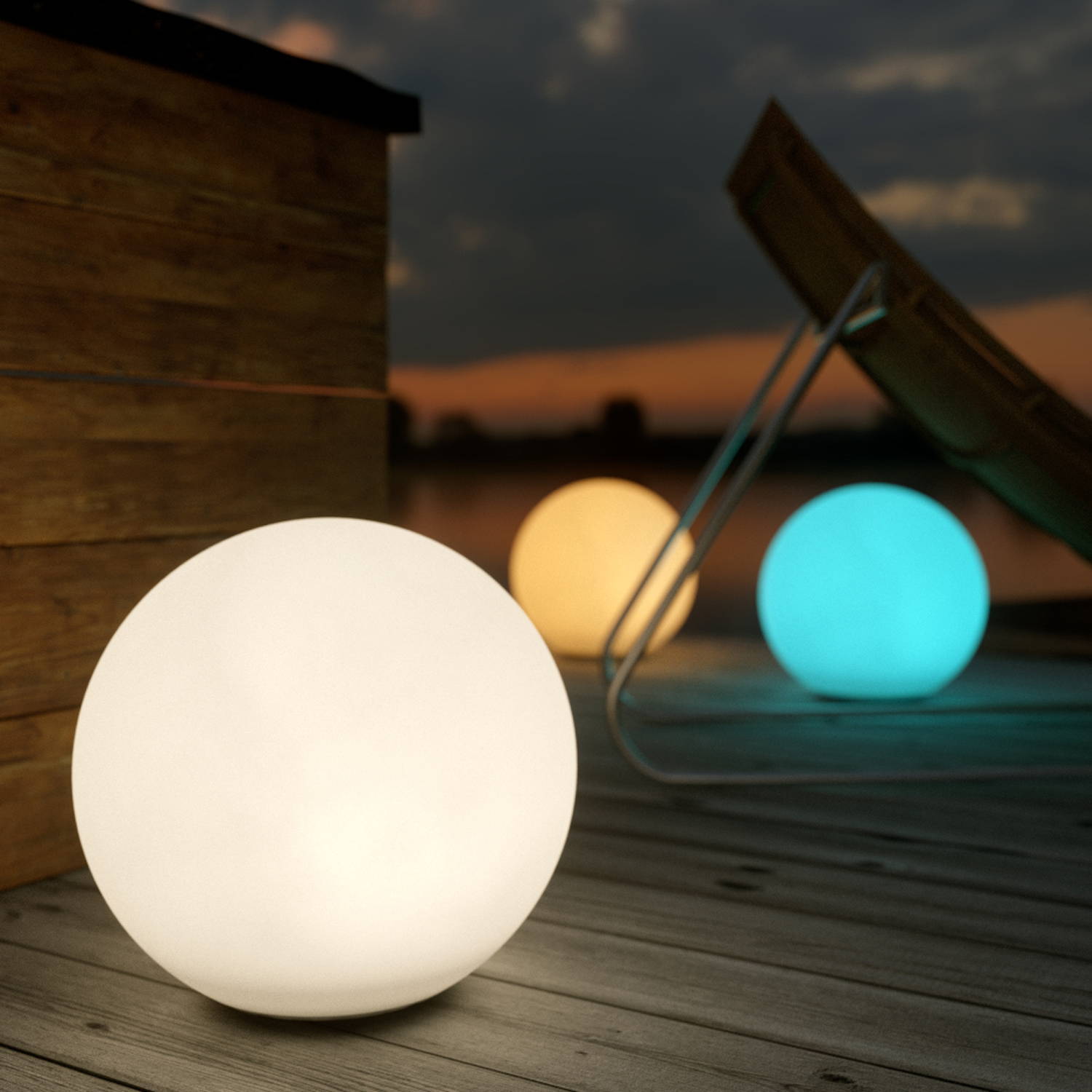 3 solar pebble lights illuminating a decking