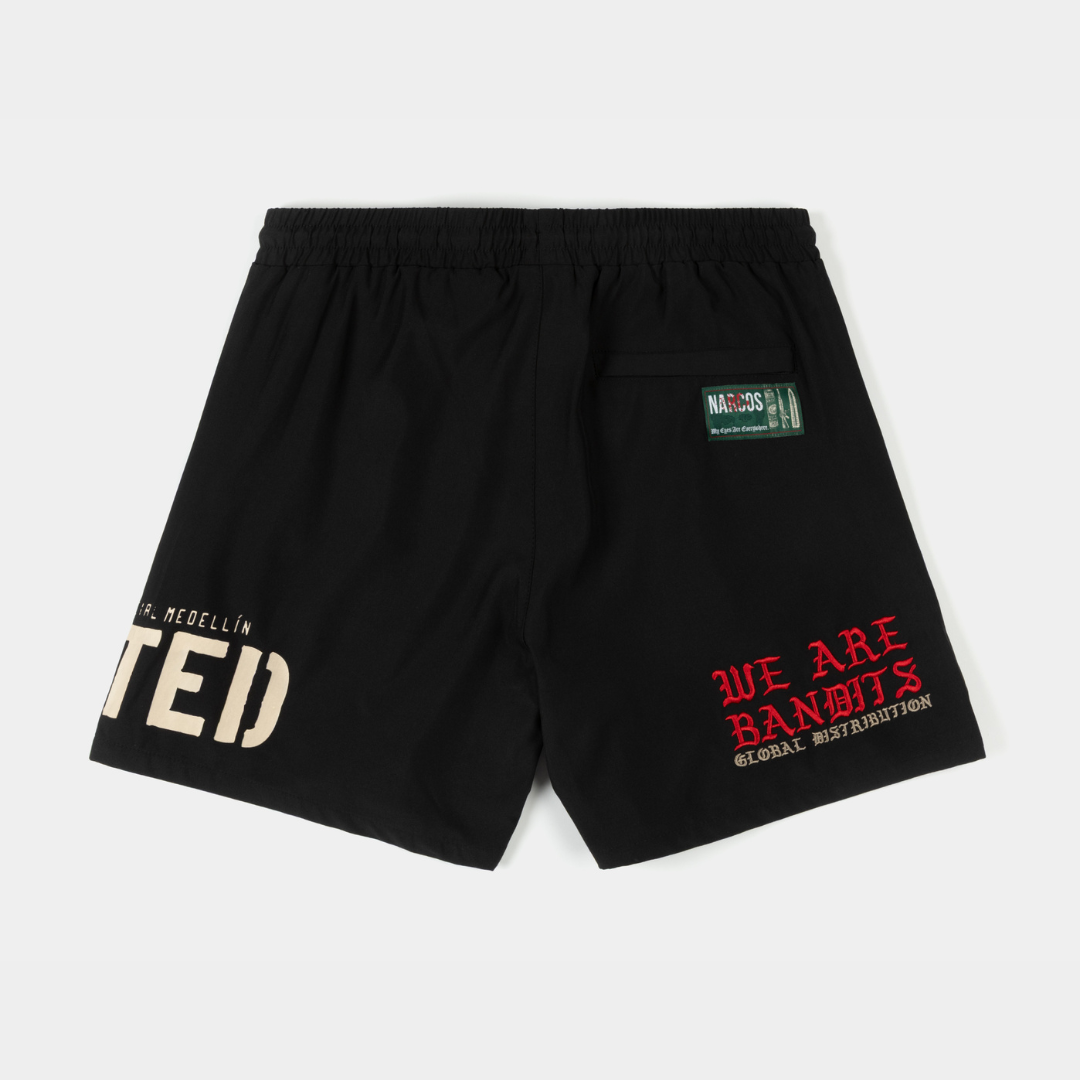 Black shorts with various graphic prints and a drawstring waist.
