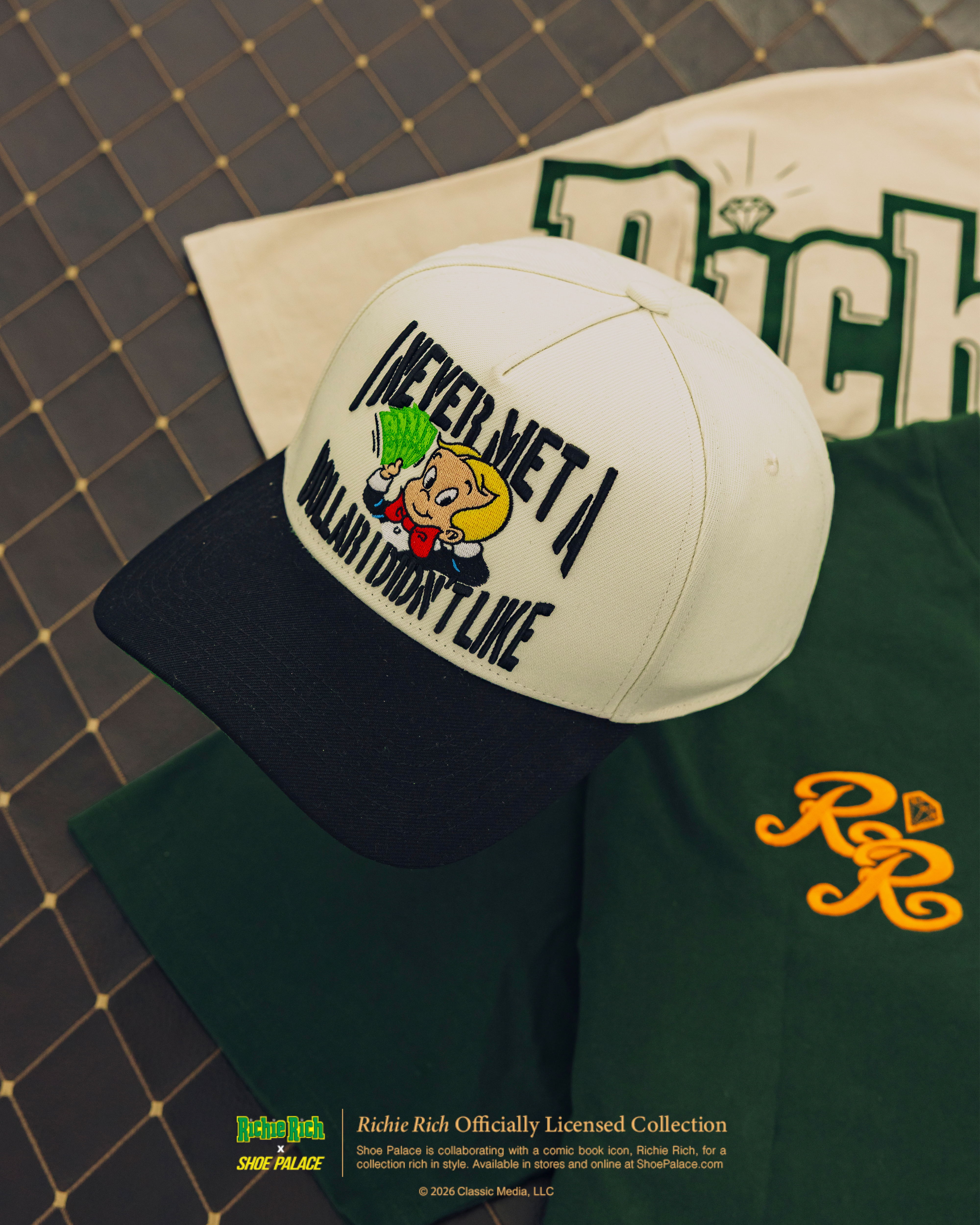 A cap with a cartoon design and text on a patterned background.