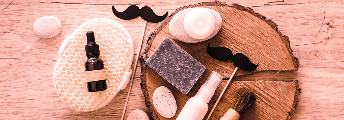 Various grooming products and accessories arranged on a wooden surface.