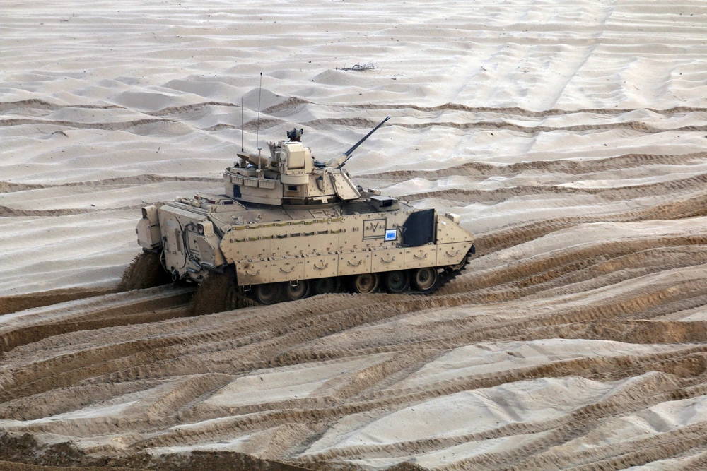 An M2A3 Bradley Fighting Vehicle from 5th Squadron, 4th Cavalry Regiment, 2nd Armored Brigade Combat Team, 1st Infantry Division, moves into position to conduct a firing systems check at the Presidenski Range, Trzebian, Poland, Sept. 20. The Brigade was in the middle of its 10-day preparation period to be mission ready. (U.S. Army photo by Staff Sgt. Wallace Bonner)