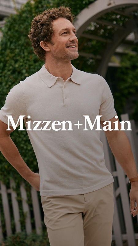 Man smiling in a polo shirt outdoors, with 