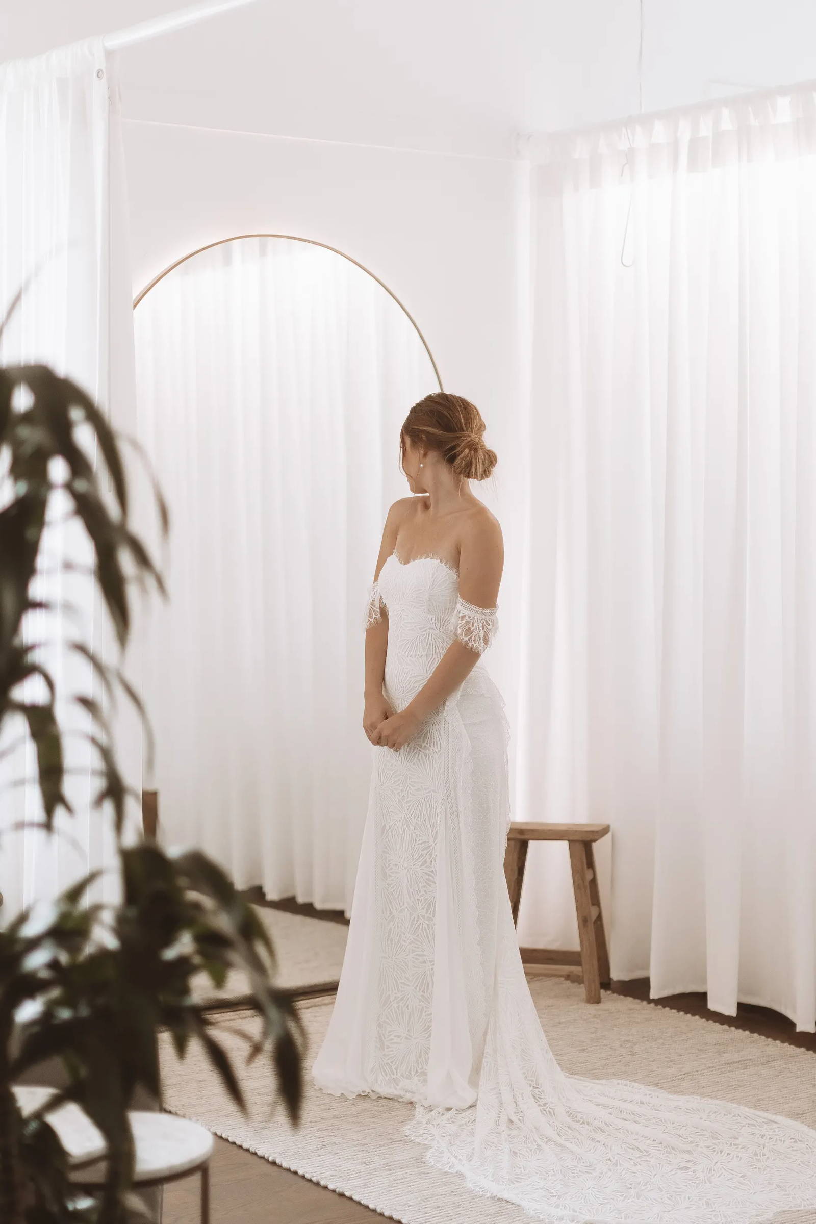 Bride in the Grace Loves Lace showroom wearing the Noad wedding dress