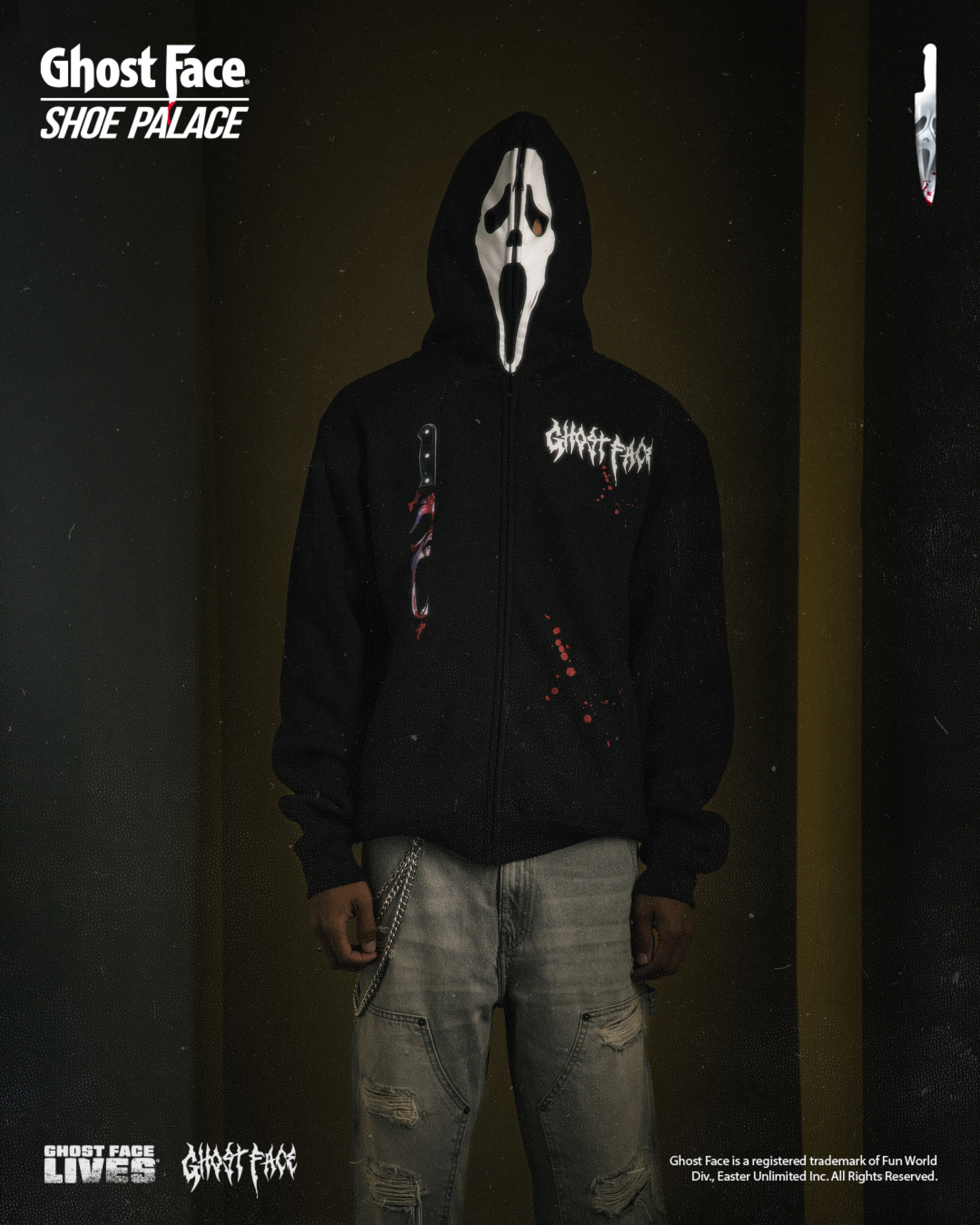 Person in Ghost Face mask wearing a black hoodie and distressed jeans.