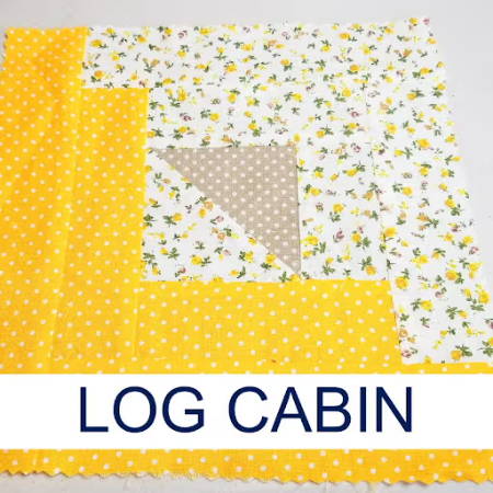 Log Cabin quilt block made out of yellow and white fabrics