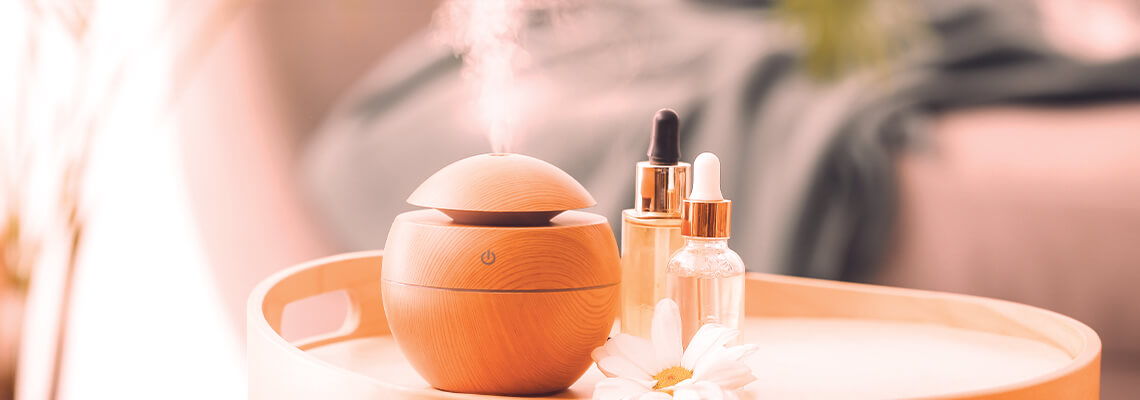 Skincare products on a round table with a soft background.