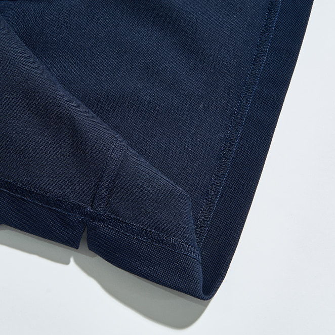 Navy blue fabric corner with stitching detail on a light background.
