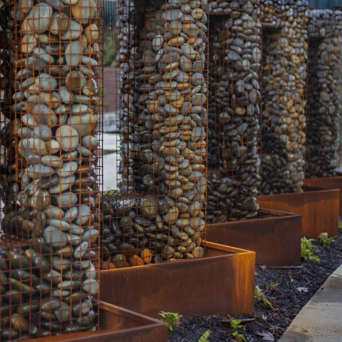 A fountain inspired by a the Gabion method of soil retention.