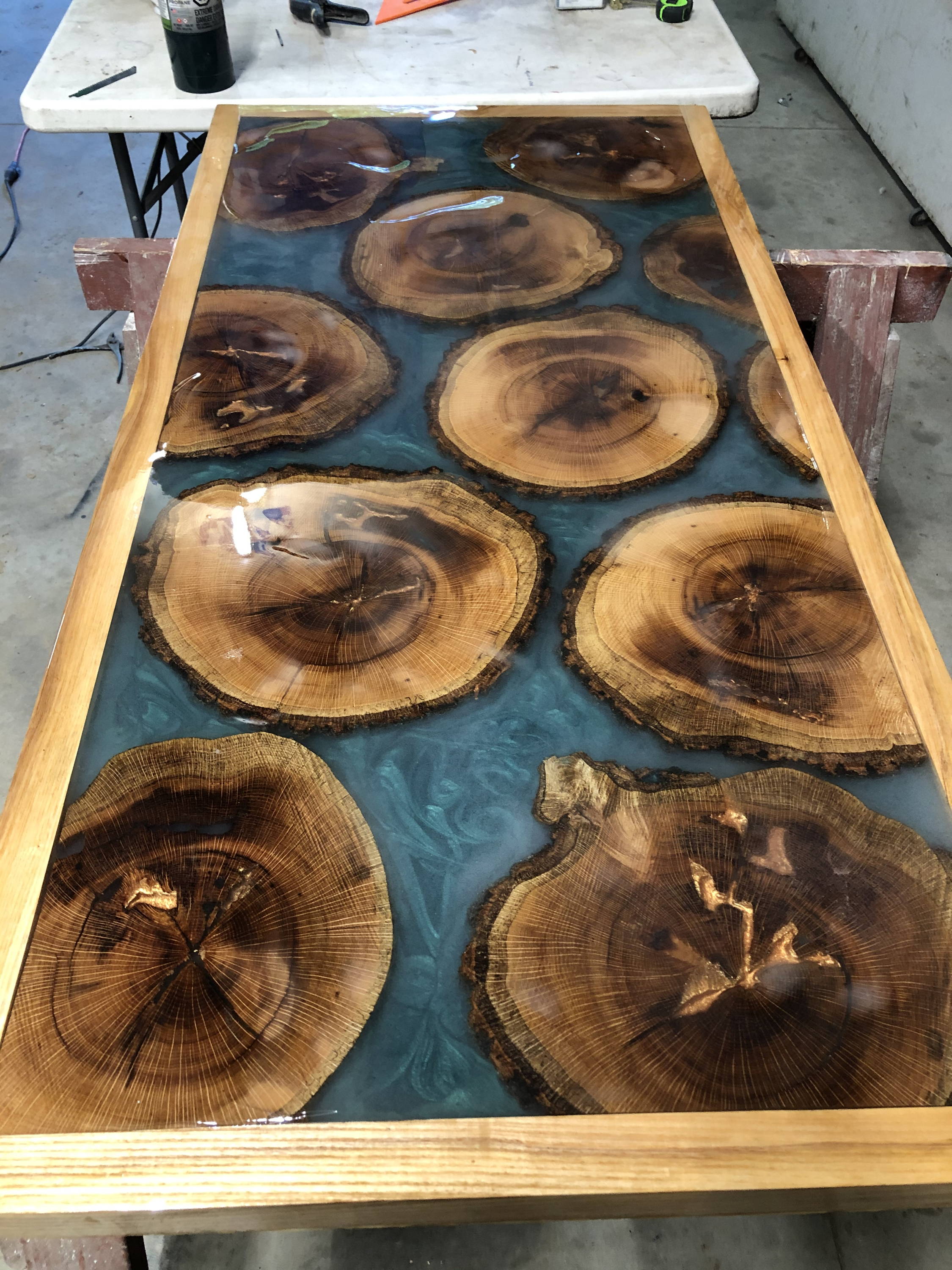 Epoxy resin table with thinly sliced decorative logs