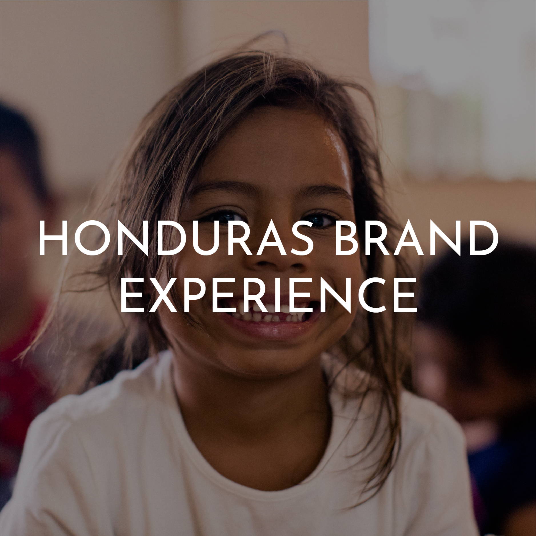 “Honduras Brand Experience” Is written on top of a smiling Honduran girl wearing a white t-shirt 