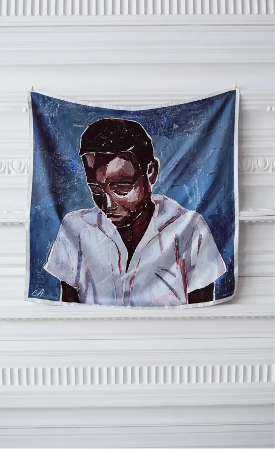 A portrait of a person in a white shirt against a blue background.