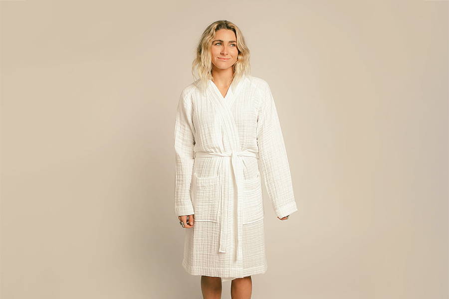 a female model wearing the organic gauzy robe in white