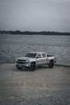 Silver 2018 Chevy Silverado 1500 Z71 at lakeside boat ramp Jackson's Outlaw 228H install thumbnail