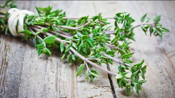 thyme on a wooden cutting board