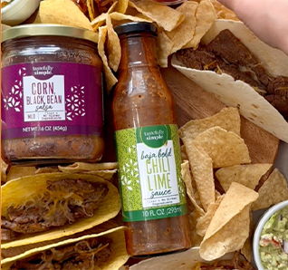 Bottle of Baja Bold Chili Lime Sauce and jar of Corn Black Bean Salsa - see more on our Instagram