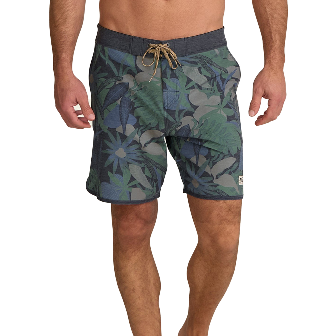 Man wearing patterned swim shorts with palm leaf design.