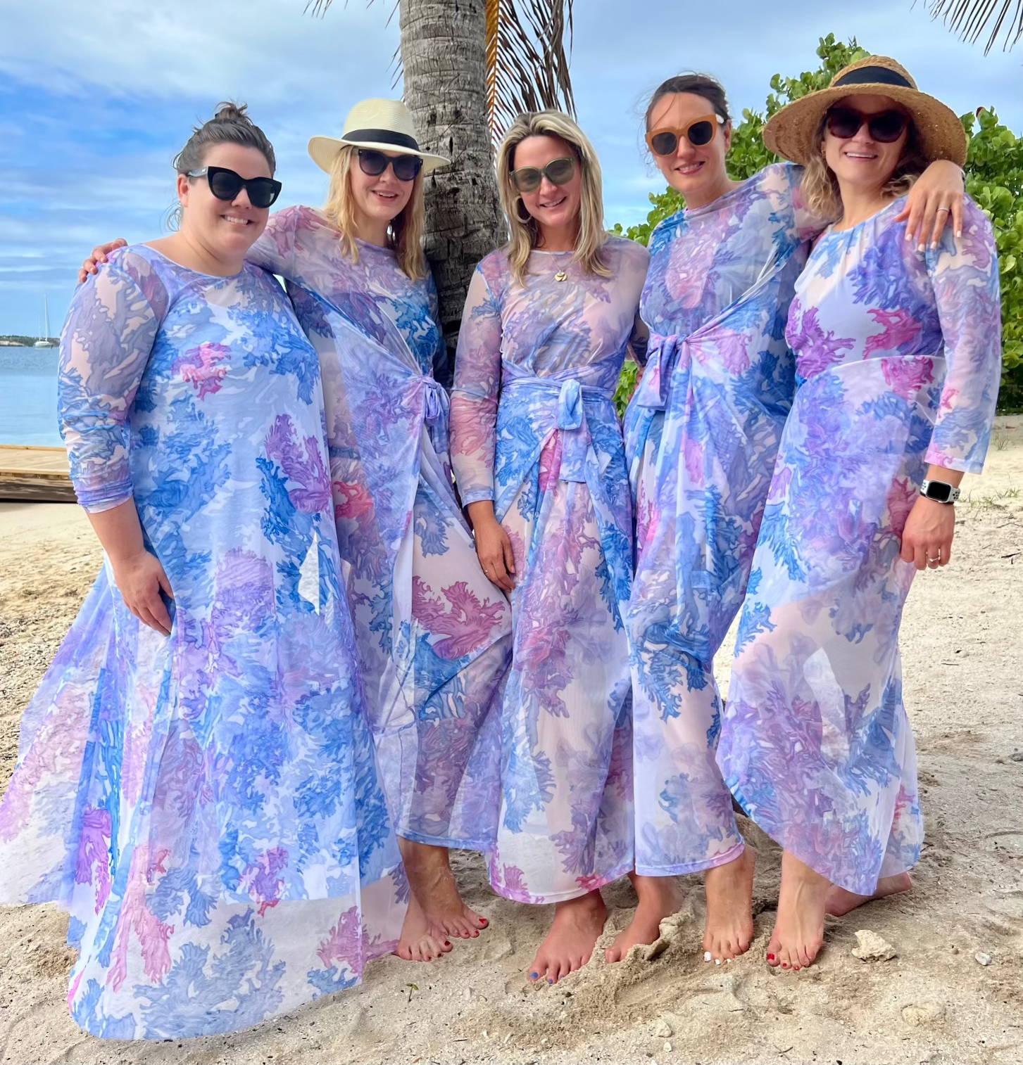 Group of girls wearing matching coral printed mesh and stretch knit beach outfits on a bachelorette in the Caribbean by Ala von Auersperg