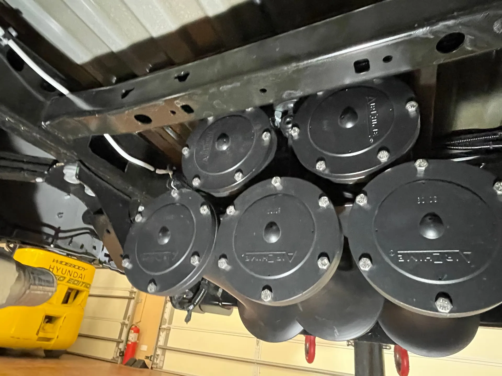 Five black Nathan AirChime K5 train horns mounted on Robert's Ford F450 undercarriage frame photo 4