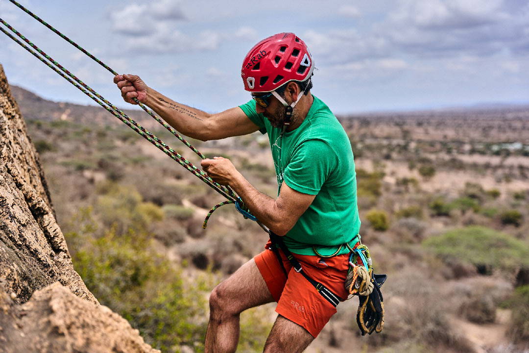 a rock climber hanging onto Sterling Kenya rope with his bare hands