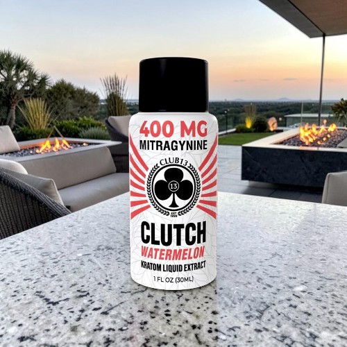 Bottle of Clutch Watermelon containing 400 mg Mitragynine on a table outdoors.
