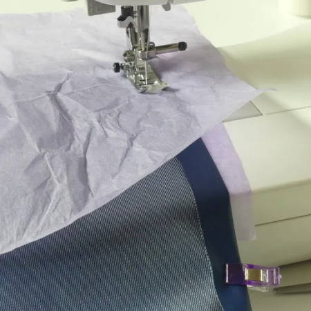Place Tissue Paper Between Presser Foot and Vinyl for Smooth Stitching