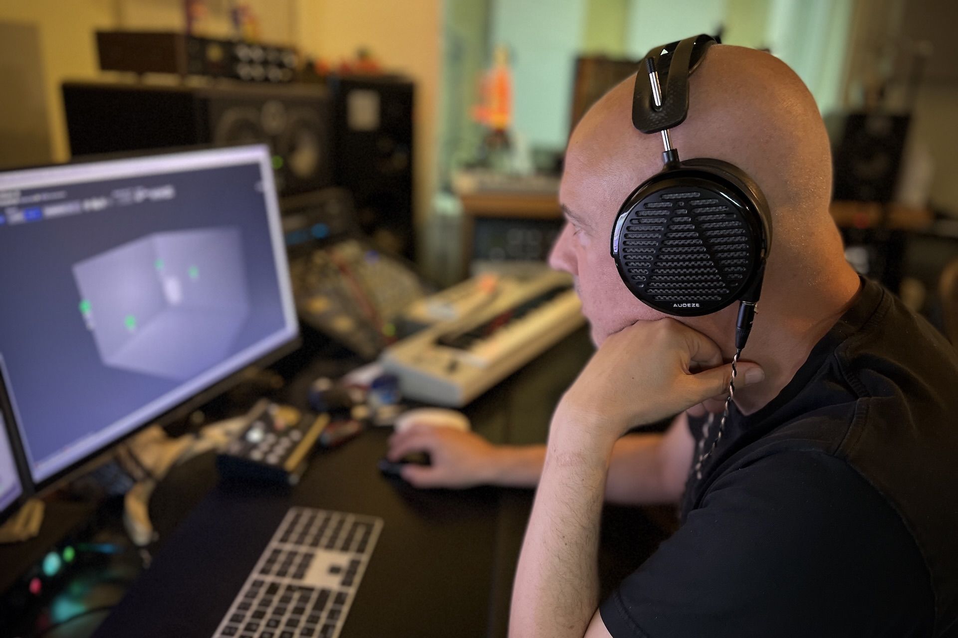 David Kosten wearing Audeze LCD-5 headphones 